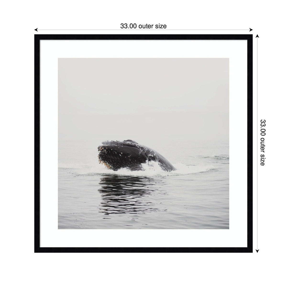 Framed square wall art print of a humpback whale breaching water under a gray sky, with soft water reflections and minimalistic tones.