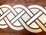 Cherry charcuterie board with complex Celtic knot inlay on White Oak wood