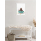 Framed canvas print of three bear cubs sitting in a teal bathtub on multicolored scattered tile, hanging above a white bench with a beige fur throw and a light brown bag.