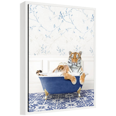 Framed canvas art depicting a tiger resting in a blue bathtub surrounded by eclectic, colorful decor accents.