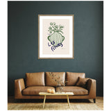 Line drawing of green flowers in a striped green vase with 'Les Fleurs' handwritten beneath, framed and hung centered above a brown leather sofa on dark green wall.
