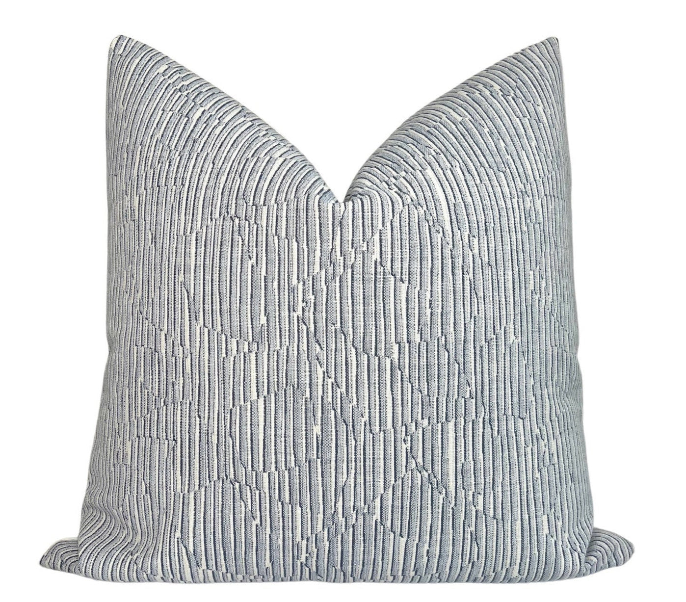 Cadence Striped Pillow Cover in Denim Blue displaying blue striped woven fabric on the front and ivory outdoor fabric backing