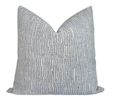 Cadence Striped Pillow Cover in Denim Blue displaying blue striped woven fabric on the front and ivory outdoor fabric backing