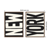 Two framed canvases with black and white typography spelling 'NEW' and 'YORK' in bold, distorted letters, adjacent horizontally in dark wood frames.