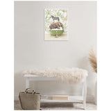 Framed canvas showing a green clawfoot bathtub holding a sleeping elephant with a zebra on its back and a giraffe behind, set against a leafy safari wallpaper.