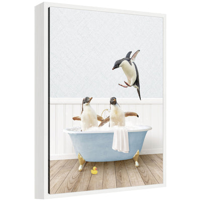 Framed floating canvas art showing penguins in a blue bathtub by Amy Peterson