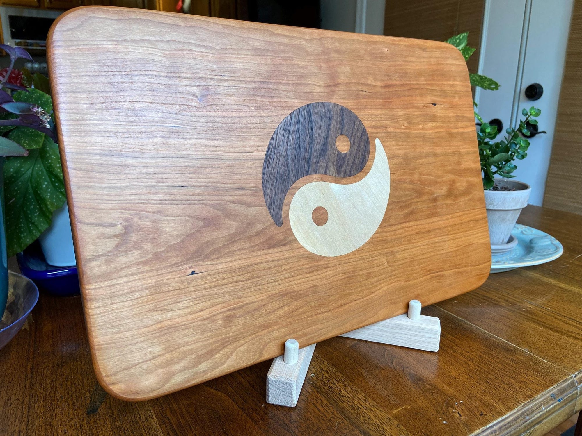 Cherry wood charcuterie board with Yin Yang inlay made from Peruvian walnut and maple