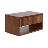 Rectangular walnut wood side table with a floating appearance featuring a carved ribbed front panel and an open storage shelf beneath it.
