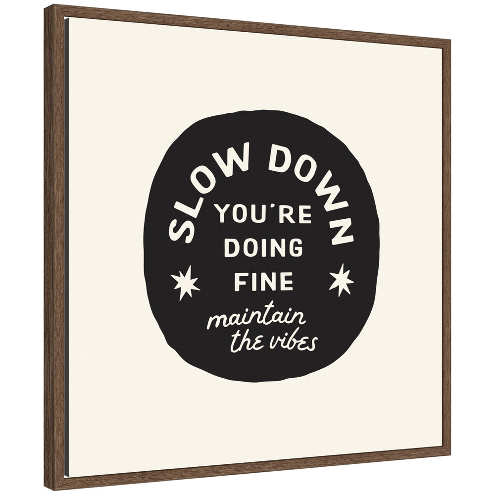 Framed canvas wall art with black and white positive quote 'Slow Down You're Doing Fine' by Lucky Guava in Sylvie walnut brown frame