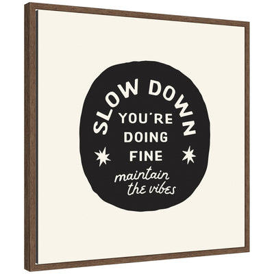 Framed canvas wall art with black and white positive quote 'Slow Down You're Doing Fine' by Lucky Guava in Sylvie walnut brown frame