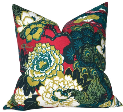 Shanghai Peacock pillow cover in cerise with ivory linen back, displayed on sofa