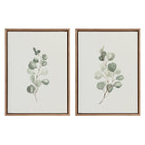 Two framed canvas eucalyptus prints with gold vintage beaded frames hung on white wall