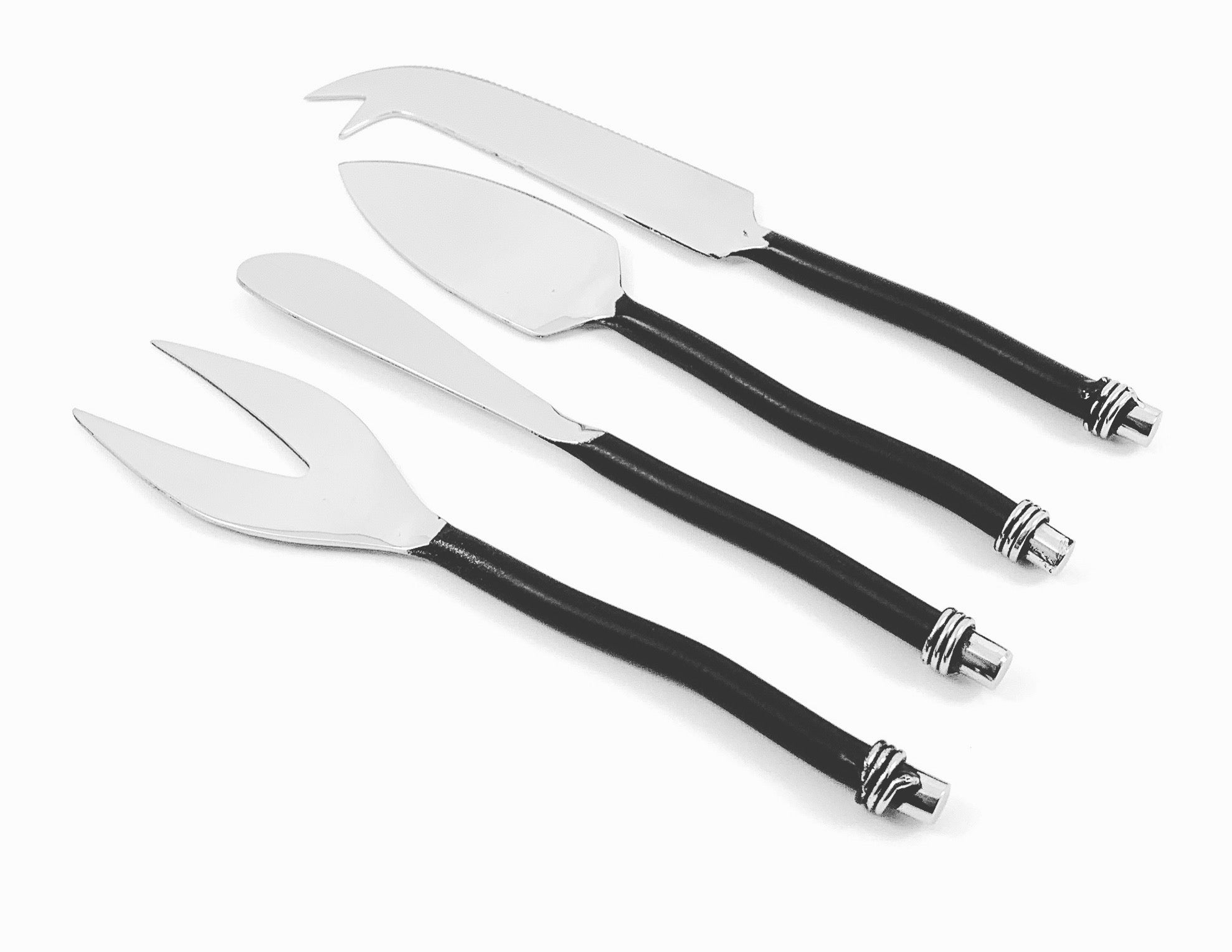 Set of four cheese knives with black curved handles displayed on a light surface