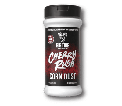 8 oz jar of Big Tine Cherry Rush Corn Dust with scattered corn kernels