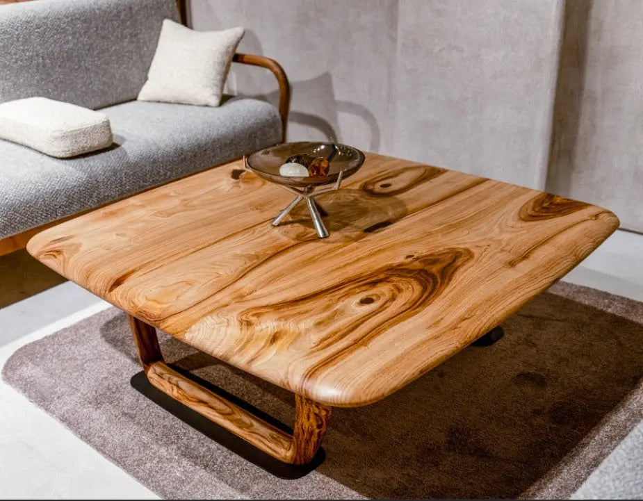 Rustic solid chestnut wood coffee table with chestnut legs in living room setting