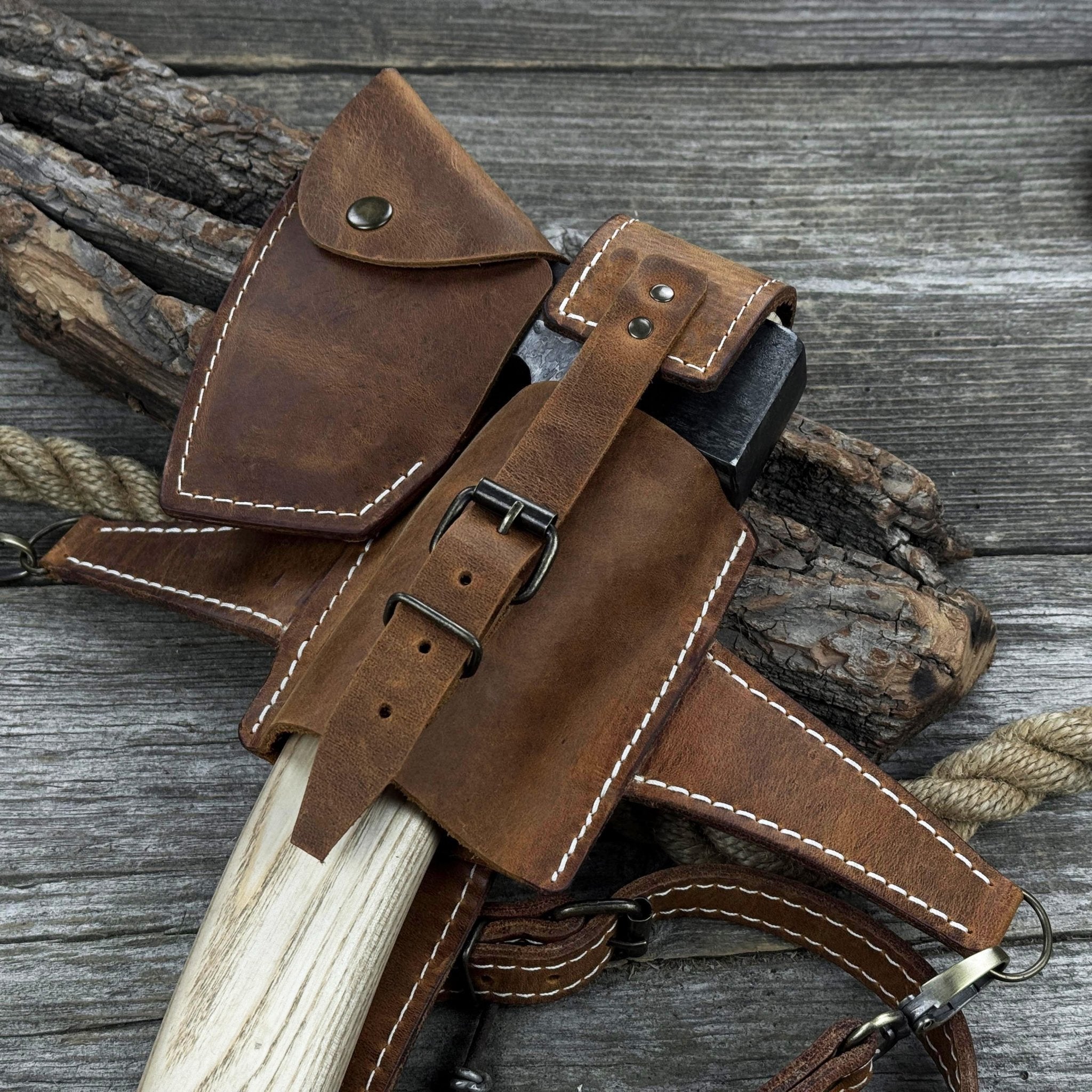 Hand-forged chopping axe with ash wood handle and leather back carry pouch