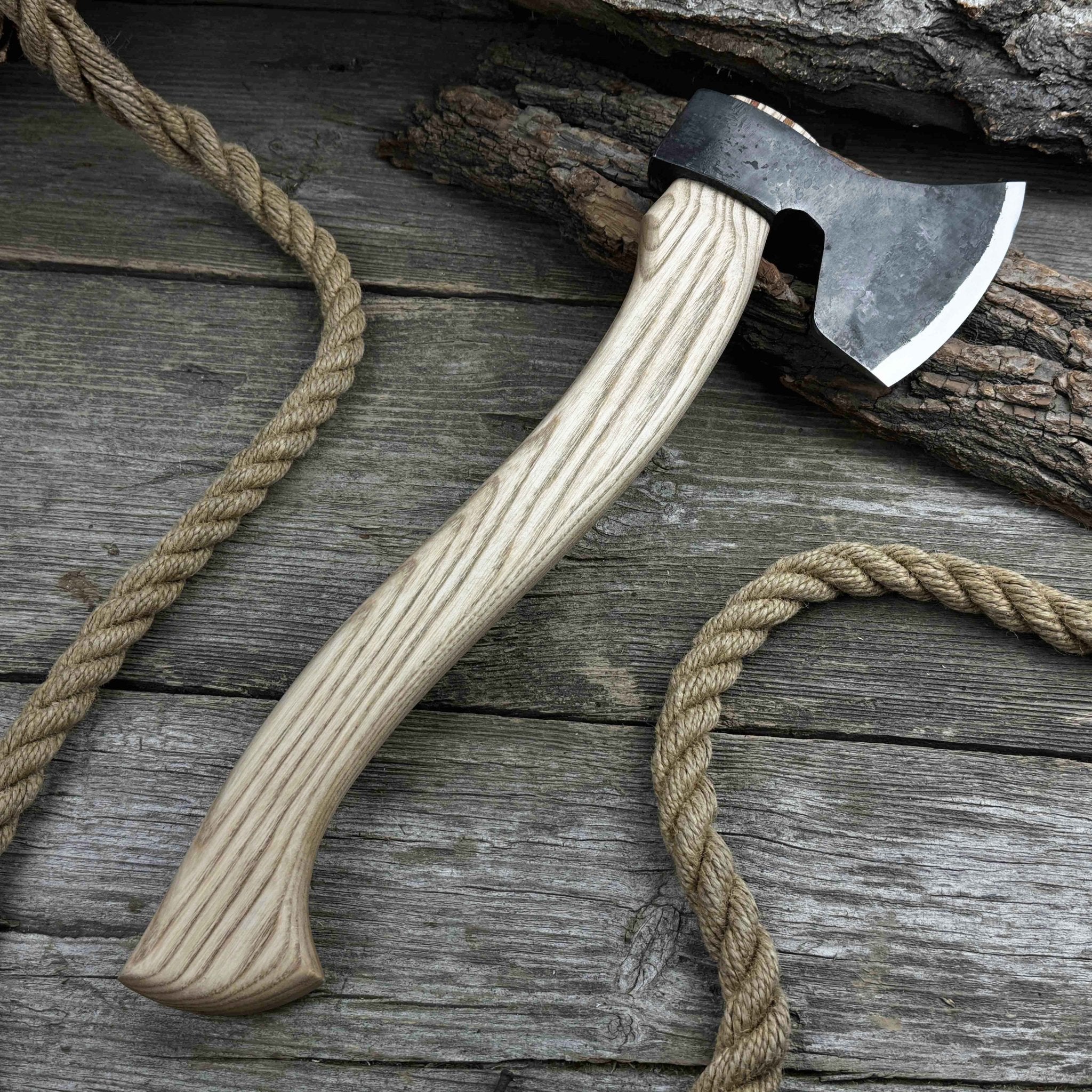 Hand-forged chopping axe with ash wood handle and leather back carry pouch