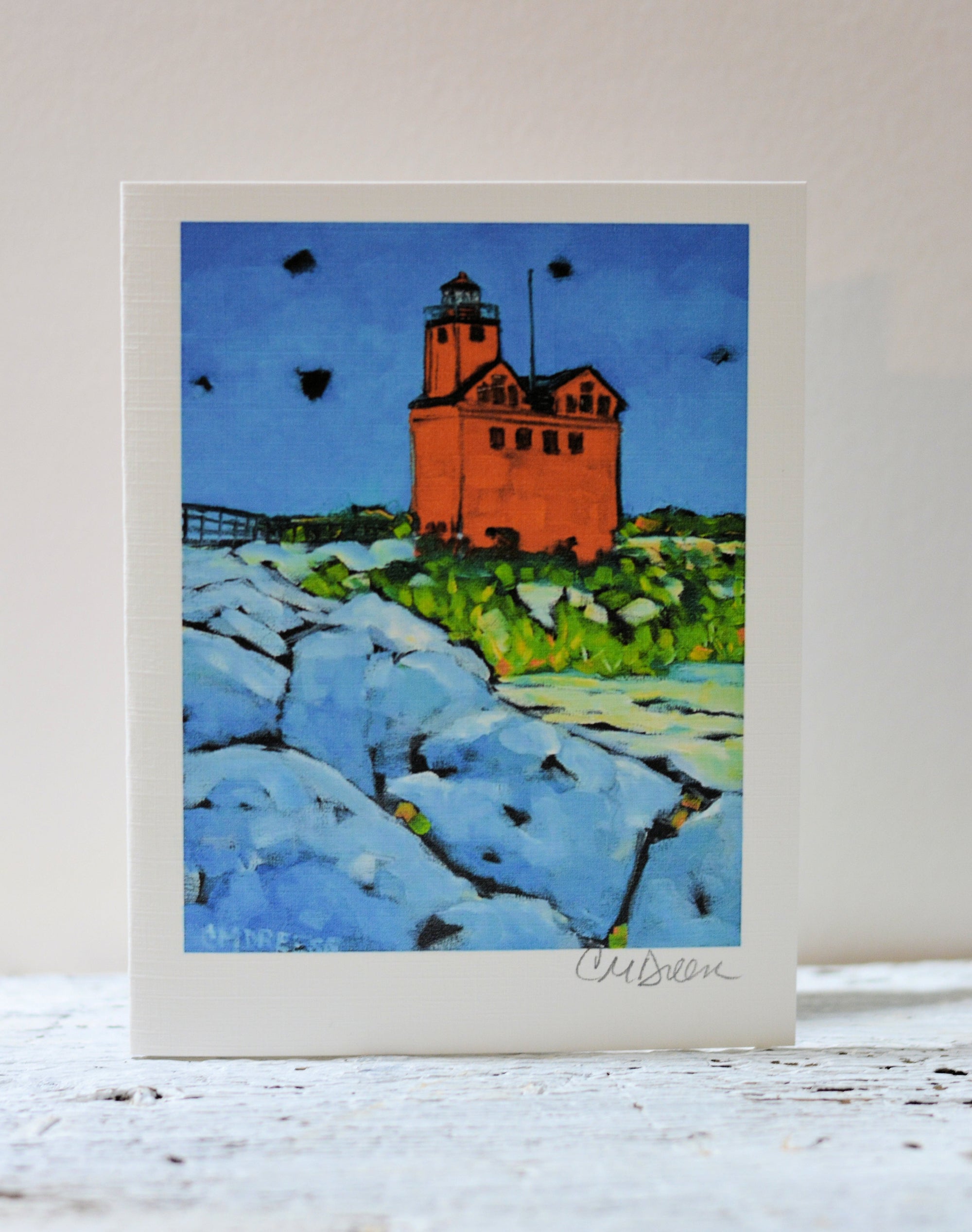 Notecard showing Holland Lighthouse artwork on front with clear packaging