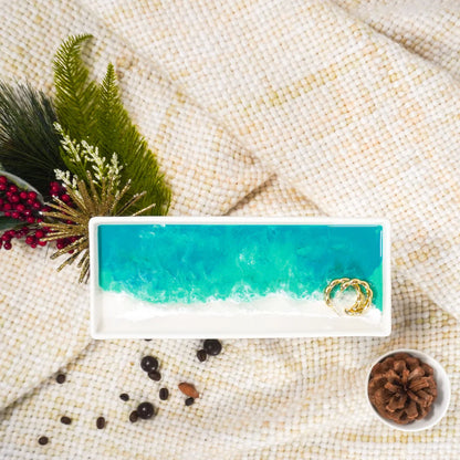 Small Ceramic Resin Tray with ocean design on a textured surface with decorative elements