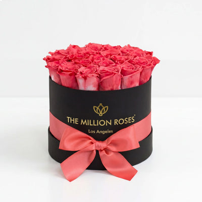 Classic Black Box with coral roses arranged neatly inside a clean black square box