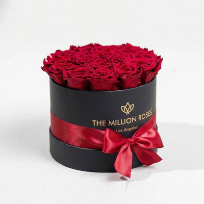 Classic Black Box containing 14-15 preserved red roses arranged neatly