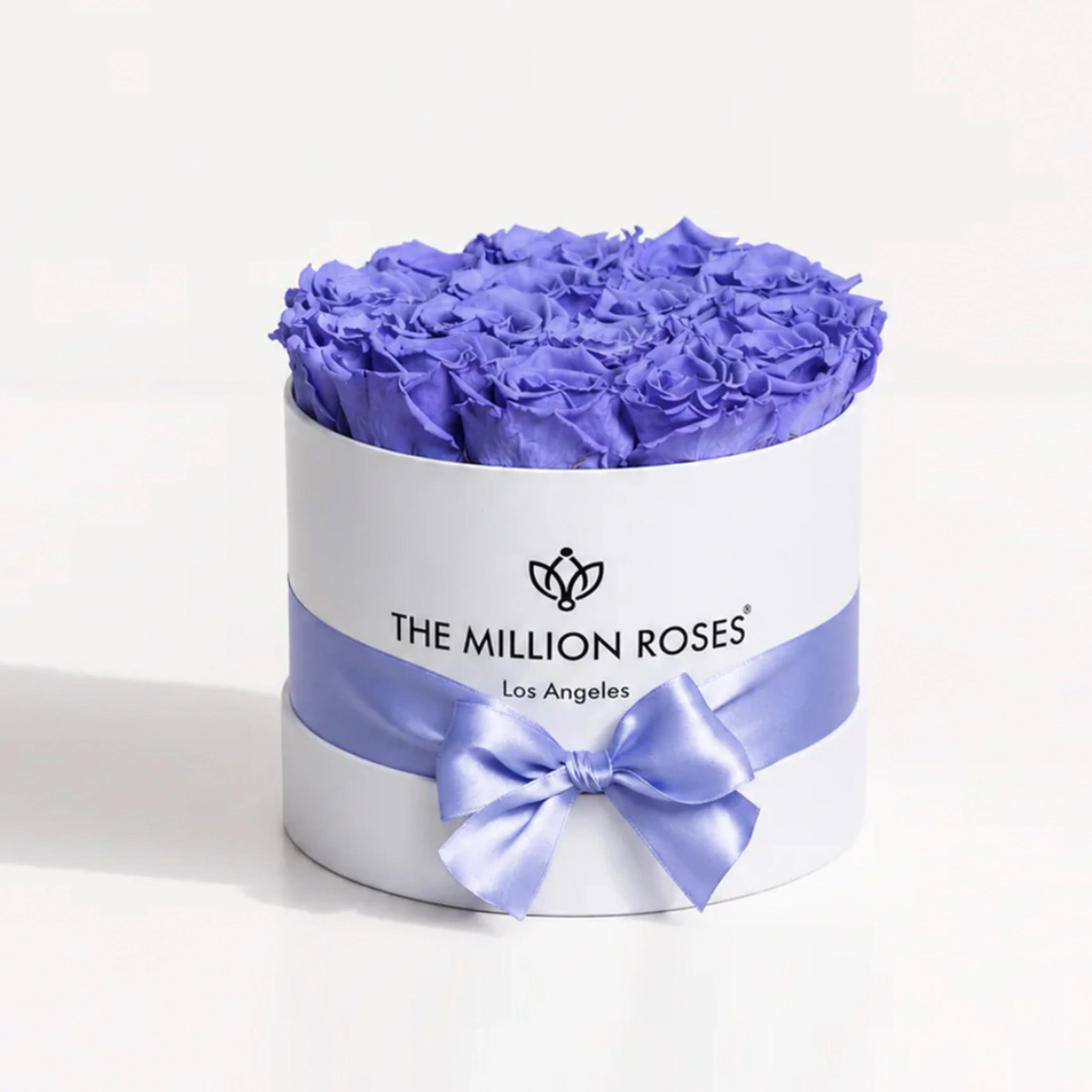 Classic White Box containing 14-15 violet roses in a square white box from The Million Roses