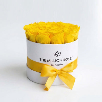 Classic White Box with 14-15 yellow roses arranged inside a white square box, shot in natural lighting.