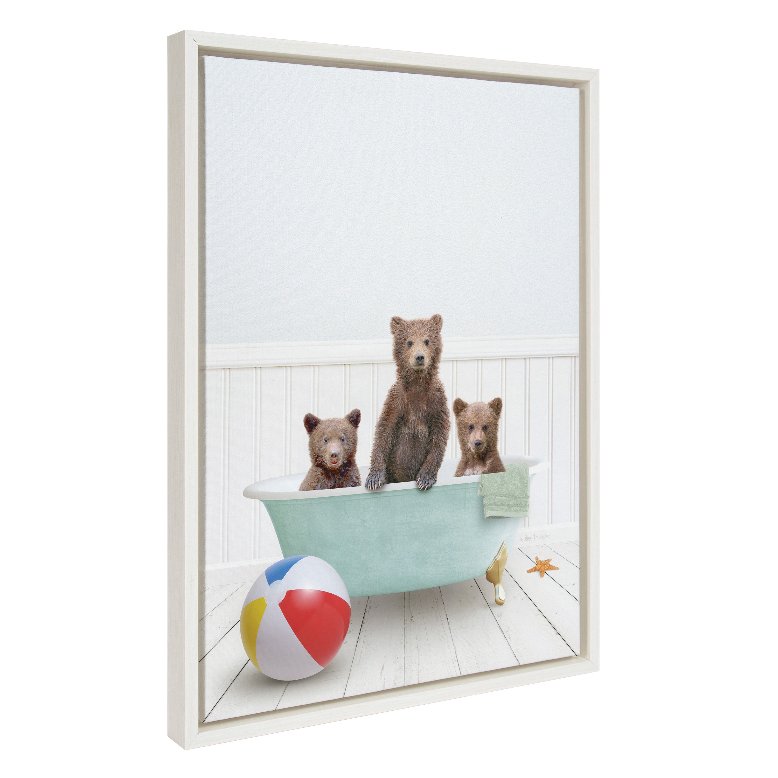Framed canvas art showing three bear cubs enjoying a bath in a cozy beach house setting