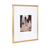 Rectangular gold photo frame with a beaded edge surrounding a white mat, displaying a centered photo of a black and white French Bulldog puppy outdoors.