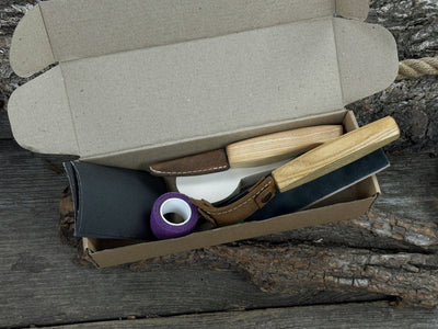Complete Spoon Carving Kit for Beginners with knives, wooden blank, sandpaper, and sharpening board