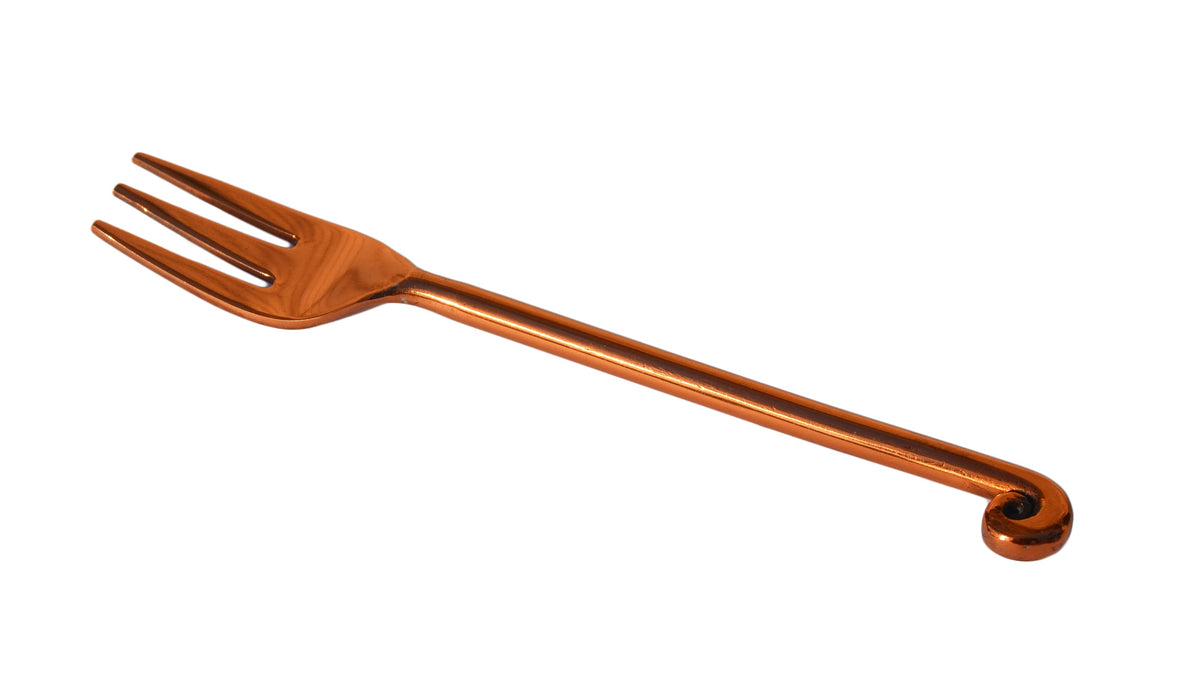 Single copper-finish appetizer fork with three tines and a decorative curled handle end against a white background.