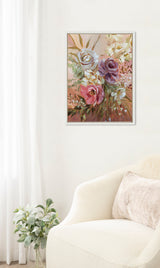 Framed canvas painting of a soft pink, purple, and cream rose bouquet with green leaves, hanging on a white wall above a cream armchair with a beige pillow.