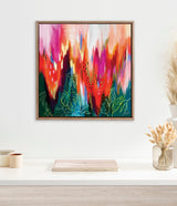Framed abstract canvas with dynamic brushstrokes in red, pink, orange, and green hues, accented by fine leaf line drawings in light green over dark areas.