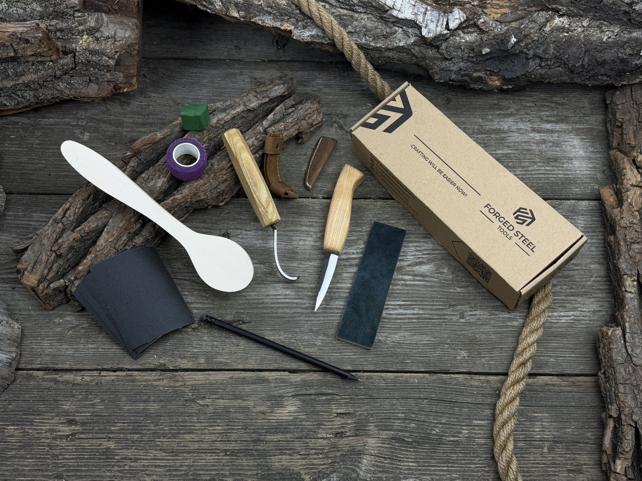 All-in-one wooden spoon whittling kit with knives, wooden blank, sandpaper, and sharpening tools