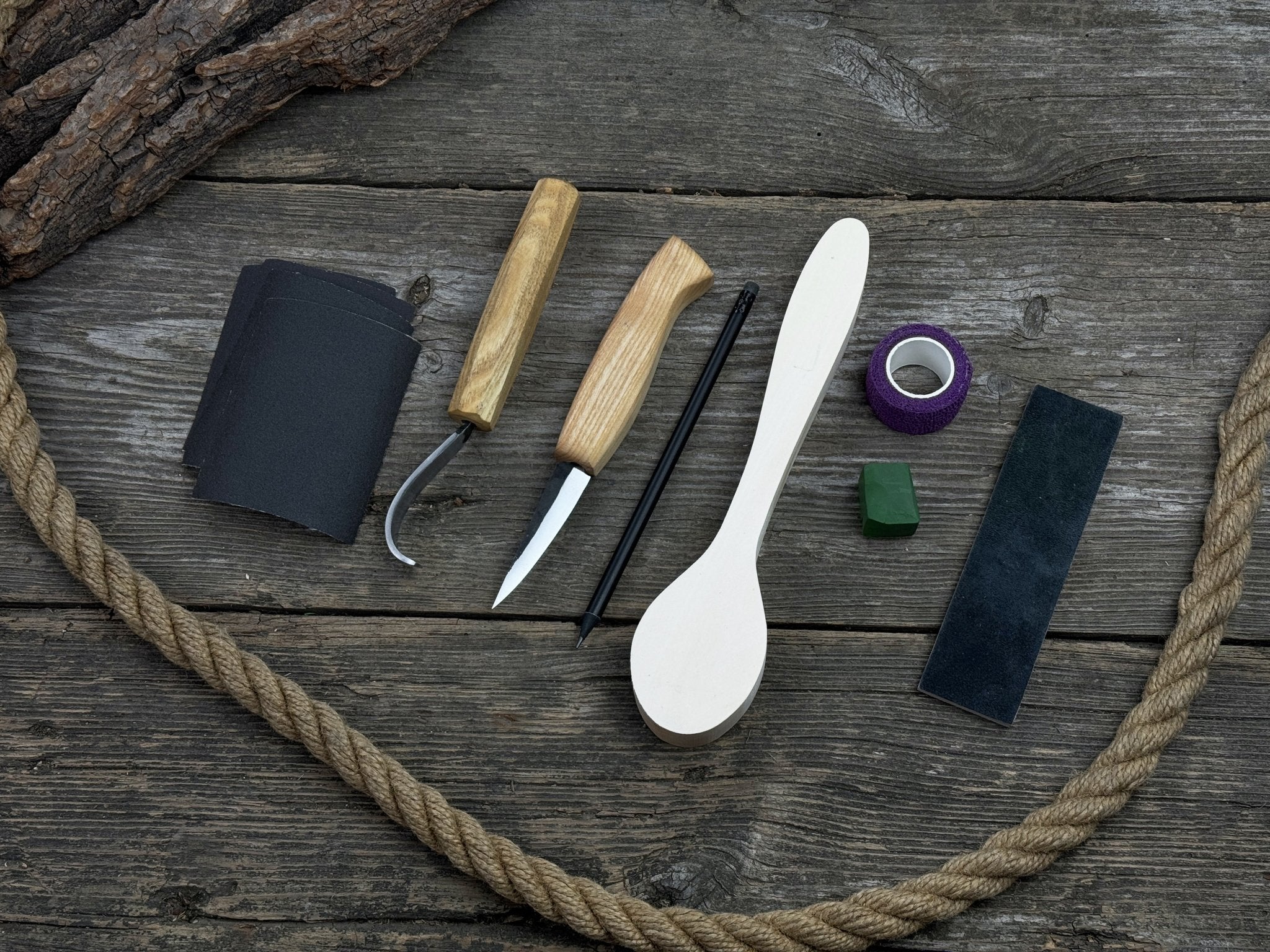 All-in-one wooden spoon whittling kit with knives, wooden blank, sandpaper, and sharpening tools