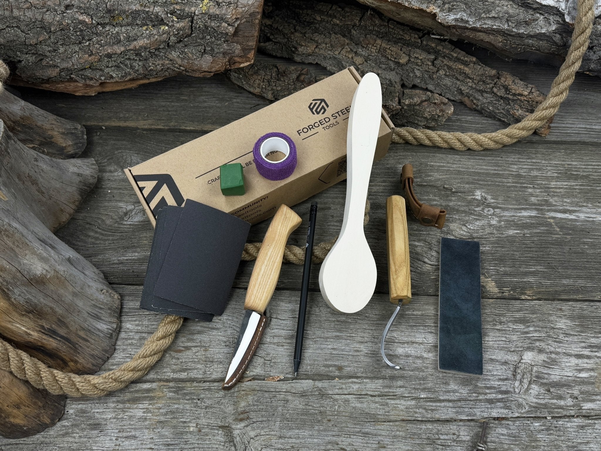 All-in-one wooden spoon whittling kit with knives, wooden blank, sandpaper, and sharpening tools