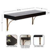 Rectangular black solid wood floating shelf with ornate brass-finished metal brackets and pre-drilled holes, measuring 23.75" by 8" by 1.75"