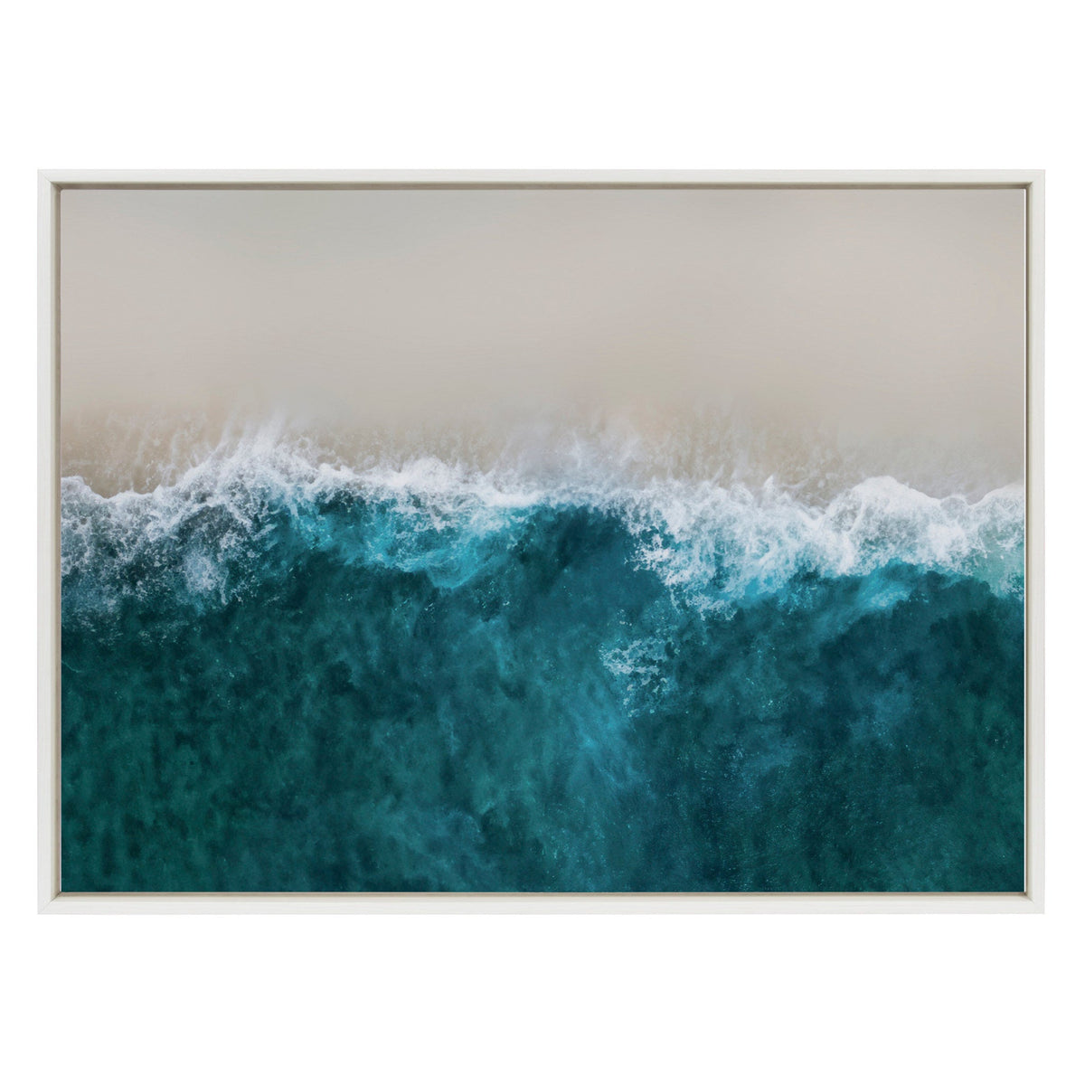 Aerial view of white foamy waves crashing onto a sandy beach with deep teal ocean water blending into light tan sand, framed in a thin white border.