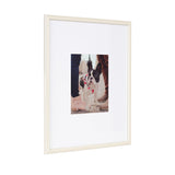Vertical white photo frame with a beaded inner border displaying a centered photo of a black and white French Bulldog wearing a pink harness, flanked by two pairs of shoes.