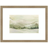 Soft watercolor landscape painting of snow-covered hills and evergreen trees under an overcast sky, framed in light wood with white matting.