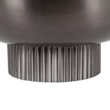 Close-up of a matte dark metal bowl's base featuring a distinctive ribbed texture with vertical grooves and a cylindrical shape.