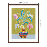 Framed stylized artwork showing a multicolored vase holding blue, white, yellow, and pink snowdrop flowers against an olive green background.