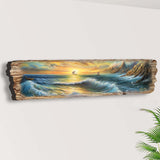 Long wooden wall art depicting a vibrant ocean scene with crashing waves, a setting sun, a sailboat, and rocky cliffs at the shore, painted in warm and cool tones.