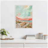 Framed canvas painting of a beach landscape with a turquoise and peach sky, sandy shore, and scattered beach vegetation in soft brushstrokes.