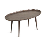 Oval coffee table with a scalloped edge and textured dark brown surface, supported by four tapered cylindrical legs matching the table top color.