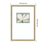 Framed print featuring minimalist white floral petals on a muted green rectangular background, set within a beige ornate frame measuring 18x26 inches outer size.