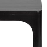 Close-up view of dark wood corner with rounded edge and smooth finish highlighting the minimalist design of a Dahl Floating Side Table.