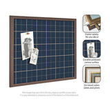 Rectangular pinboard with navy blue fabric featuring a light tan grid pattern, framed in dark wood, holding two pinned black-and-white photos.