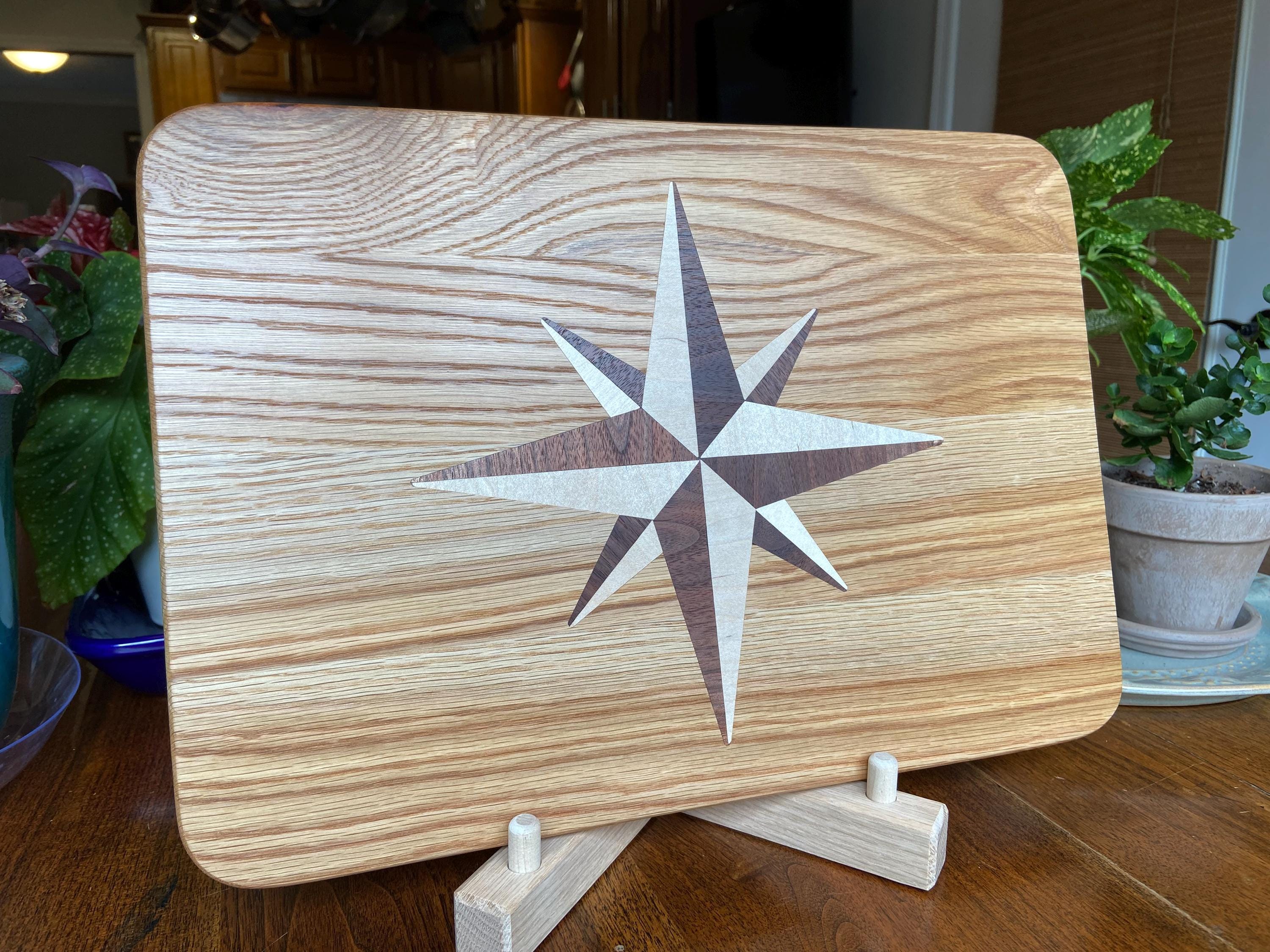 Handcrafted white oak charcuterie board with compass rose inlay