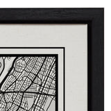 Close-up of framed black and white New York City map artwork with detailed street grid and two black borders on textured white canvas.